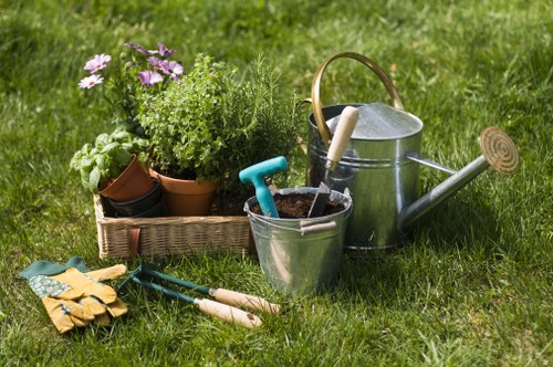 Gardener Raynes Park working in a vibrant garden